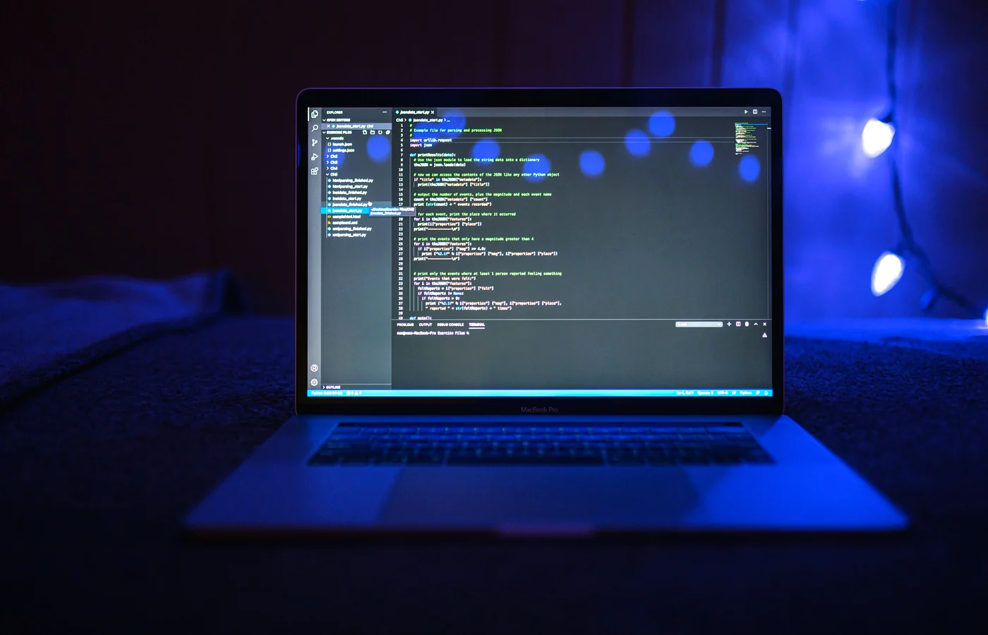 Website development code displayed on a laptop screen